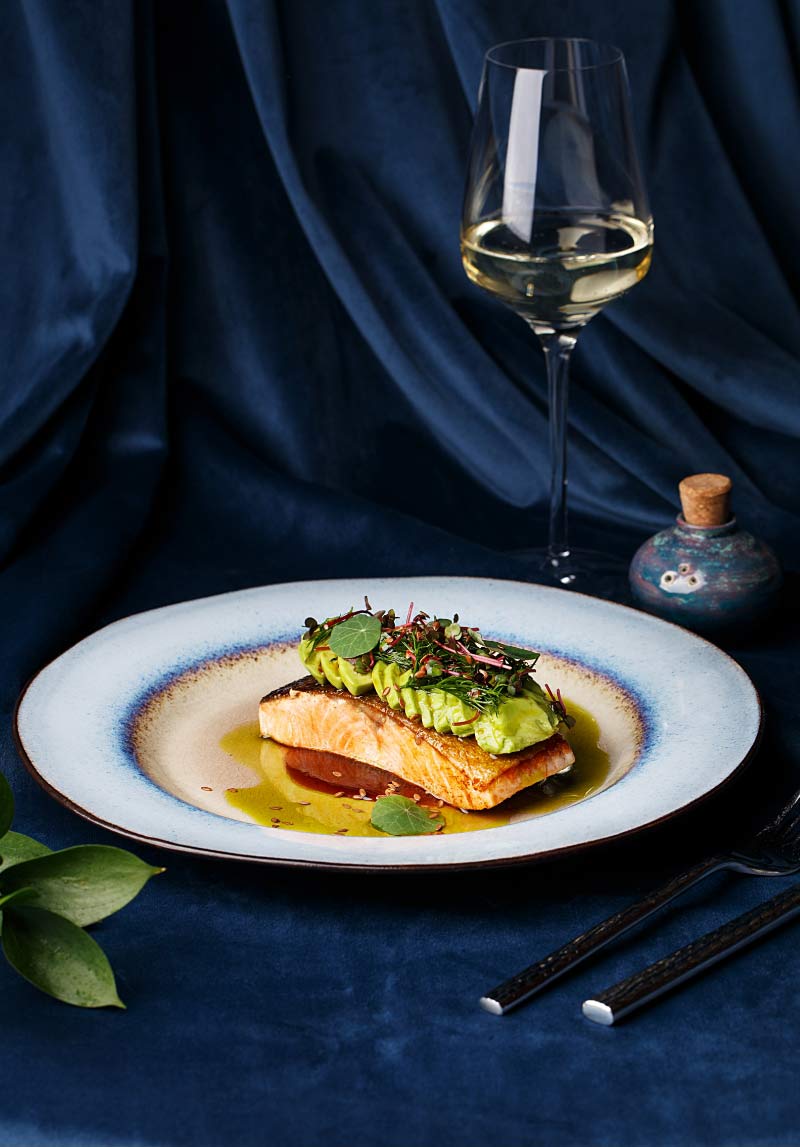 Pan-seared fish fillet with avocado and microgreens — signature dish at Taste of Istanbul Dubai
