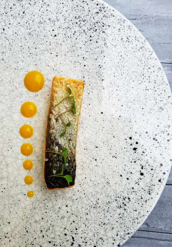 Turkish appetizer with yellow saffron sauce dots — fine dining at Taste of Istanbul Dubai